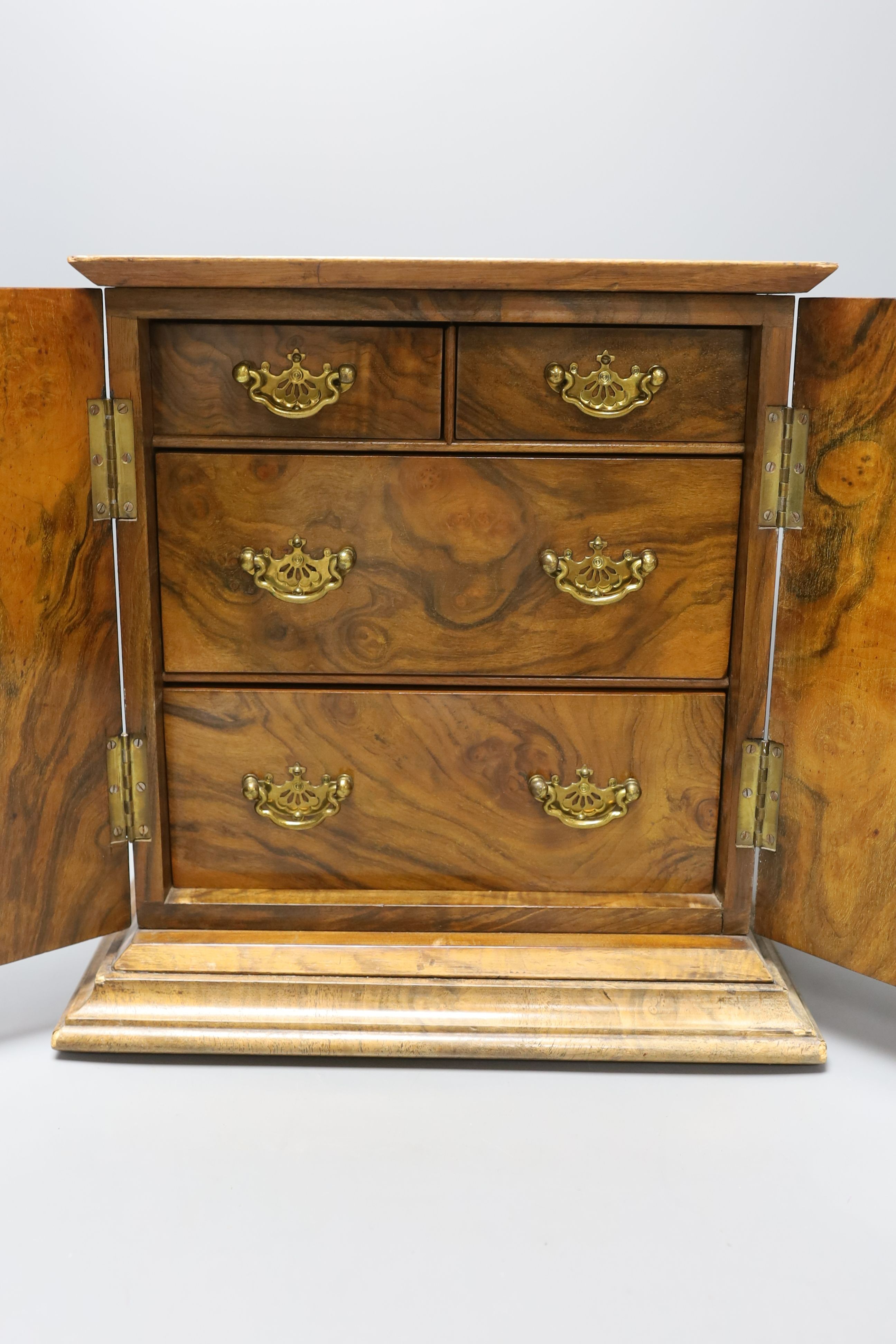 An Edwardian inlaid walnut table cabinet, 34cm wide